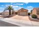 Attractive single-story home with a low-maintenance yard and attached two-car garage, presenting a clean and tidy appearance at 9305 Quail Ridge Dr, Las Vegas, NV 89134