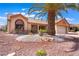 Well-maintained single-story home featuring desert landscaping, a mature palm tree, and an inviting facade at 9305 Quail Ridge Dr, Las Vegas, NV 89134