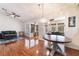 Open-concept living space with wood floors, designer lighting and comfortable seating at 9305 Quail Ridge Dr, Las Vegas, NV 89134