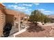 Outdoor patio with stone features and a covered pergola perfect for entertaining at 9305 Quail Ridge Dr, Las Vegas, NV 89134