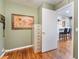 Light green room with hardwood flooring provides access to the kitchen area at 9305 Quail Ridge Dr, Las Vegas, NV 89134