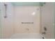 Bright shower over tub combination with tiled surround and chrome fixtures at 9305 Quail Ridge Dr, Las Vegas, NV 89134