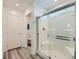 Bathroom with a glass-enclosed shower and an adjacent water closet at 10650 Sariah Skye Ave, Las Vegas, NV 89166