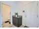 Practical bathroom, vanity with granite countertop, and modern electronic control panel by entrance at 10650 Sariah Skye Ave, Las Vegas, NV 89166