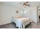Bright bedroom with neutral walls, plush carpets, ceiling fan and a window for natural light at 10650 Sariah Skye Ave, Las Vegas, NV 89166
