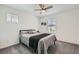 Well-lit bedroom with plush carpeting, ceiling fan and modern window treatments for a relaxing space at 10650 Sariah Skye Ave, Las Vegas, NV 89166