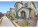 Daytime view of a charming two-story home with landscaped front yard at 10650 Sariah Skye Ave, Las Vegas, NV 89166