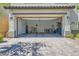 Two-car garage with a wide driveway and paved stone at 10650 Sariah Skye Ave, Las Vegas, NV 89166
