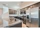 Modern kitchen with stainless steel appliances, granite countertops, and ample cabinetry at 10650 Sariah Skye Ave, Las Vegas, NV 89166