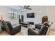 Bright living room featuring comfortable seating, TV, and neutral decor at 10650 Sariah Skye Ave, Las Vegas, NV 89166