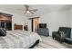This main bedroom offers wood-look flooring, a ceiling fan, and a closet with sliding doors at 10650 Sariah Skye Ave, Las Vegas, NV 89166