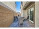 Back patio with a fire pit, outdoor seating, and decorative lighting at 10650 Sariah Skye Ave, Las Vegas, NV 89166