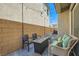 Cozy patio with outdoor seating, fire pit, and string lights at 10650 Sariah Skye Ave, Las Vegas, NV 89166