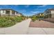 Walking path between properties featuring desert landscaping and decorative rock at 10650 Sariah Skye Ave, Las Vegas, NV 89166