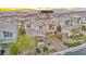Beautiful aerial view of a modern home with desert landscaping, pool, and mountain views at 19 Hilltop Crest St, Henderson, NV 89011