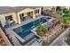 Aerial shot of the backyard pool and spa with lounge area and outdoor kitchen at 19 Hilltop Crest St, Henderson, NV 89011