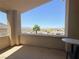 Inviting balcony with mountain views and a small table creating an intimate outdoor dining experience at 19 Hilltop Crest St, Henderson, NV 89011