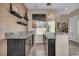 This modern bar area features stylish granite countertops and a decorative pendant light at 19 Hilltop Crest St, Henderson, NV 89011