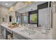 This bathroom boasts a double vanity, soaking tub, and separate shower with glass enclosure at 19 Hilltop Crest St, Henderson, NV 89011