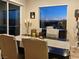 Dining area features evening views of city lights at 19 Hilltop Crest St, Henderson, NV 89011