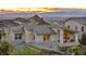Exterior elevation with tile roof, a mountain view and desert landscaping at 19 Hilltop Crest St, Henderson, NV 89011