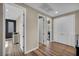 Hallway with hardwood floors, white trim, recessed lighting, and multiple doors that enhance flow at 19 Hilltop Crest St, Henderson, NV 89011