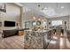 An open floorplan kitchen featuring marble countertops and stainless steel appliances at 19 Hilltop Crest St, Henderson, NV 89011