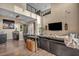 Open living room with high ceilings, modern decor, sleek furniture, and balcony access at 19 Hilltop Crest St, Henderson, NV 89011