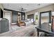 Spacious main bedroom featuring a tufted headboard, wood floors, and stylish decor at 19 Hilltop Crest St, Henderson, NV 89011