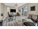 Stylish office space with a modern chandelier, desk and balcony access showcasing scenic views at 19 Hilltop Crest St, Henderson, NV 89011