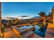 A multi-tiered pool with spa and a view of other homes in the neighborhood at 19 Hilltop Crest St, Henderson, NV 89011