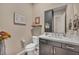 This powder room includes modern fixtures and stylish decorations at 19 Hilltop Crest St, Henderson, NV 89011