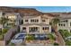 A view of the back of the home and pool, with a mountain range in the background at 19 Hilltop Crest St, Henderson, NV 89011