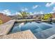 Image of backyard spa with clear water and an open view to the landscape at 19 Hilltop Crest St, Henderson, NV 89011