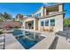 This backyard boasts a pristine swimming pool and outdoor seating at 19 Hilltop Crest St, Henderson, NV 89011