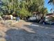 An exterior view of a home featuring a gravel area, a white pickup truck, and miscellaneous stored items at 2510 Sunrise St, Las Vegas, NV 89101