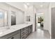 Bathroom with double sink, large mirror and walk-in shower at 31 Autumn Palm Ave, Henderson, NV 89011