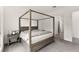 Bedroom featuring a four-poster bed and neutral decor at 31 Autumn Palm Ave, Henderson, NV 89011