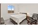 Bright bedroom featuring a window and chair at 31 Autumn Palm Ave, Henderson, NV 89011