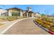 Community clubhouse featuring desert landscaping and a brick driveway at 31 Autumn Palm Ave, Henderson, NV 89011