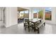 Bright dining area with a wooden table set and views of the landscaped backyard at 31 Autumn Palm Ave, Henderson, NV 89011