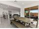 Open dining area with backyard views, seamlessly connected to the kitchen and living room at 31 Autumn Palm Ave, Henderson, NV 89011