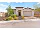 Charming single-story home featuring a well-manicured front yard and a two car garage at 31 Autumn Palm Ave, Henderson, NV 89011