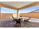 Charming covered patio with a brick paver floor and comfortable seating arrangement at 31 Autumn Palm Ave, Henderson, NV 89011