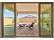 Covered patio featuring comfortable seating, perfect for outdoor relaxation and entertaining at 31 Autumn Palm Ave, Henderson, NV 89011