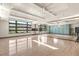 Bright studio with large windows, mirrored wall, wood flooring, and ample space for activities at 31 Autumn Palm Ave, Henderson, NV 89011