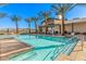 Resort-style pool area with palm trees and lounge chairs at community clubhouse at 31 Autumn Palm Ave, Henderson, NV 89011