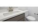 Modern bathroom featuring quartz countertops, gray cabinets, and brushed nickel faucet at 352 Tigullio Ave, Henderson, NV 89011