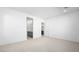 Bright bedroom with carpet, leading to a bathroom and closet, offering a comfortable and private space at 352 Tigullio Ave, Henderson, NV 89011