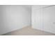 Neutral bedroom with neutral carpet and standard closet with double doors at 352 Tigullio Ave, Henderson, NV 89011